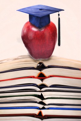 Manzana con birrete y libros